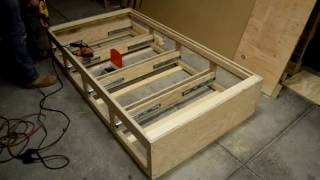 twin bed with drawers underneath and headboard